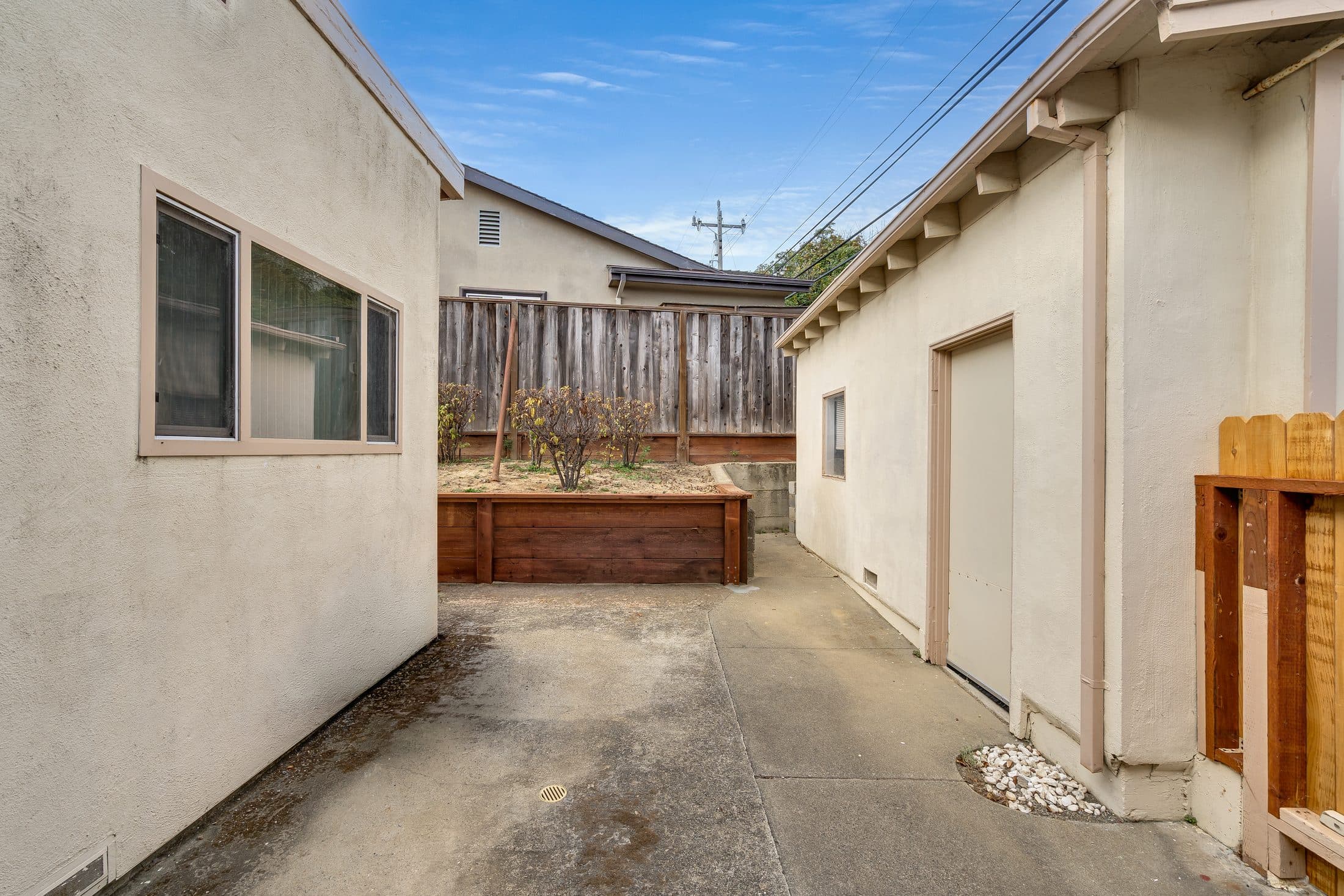 898 Lomita Avenue. Between the house and the garage.