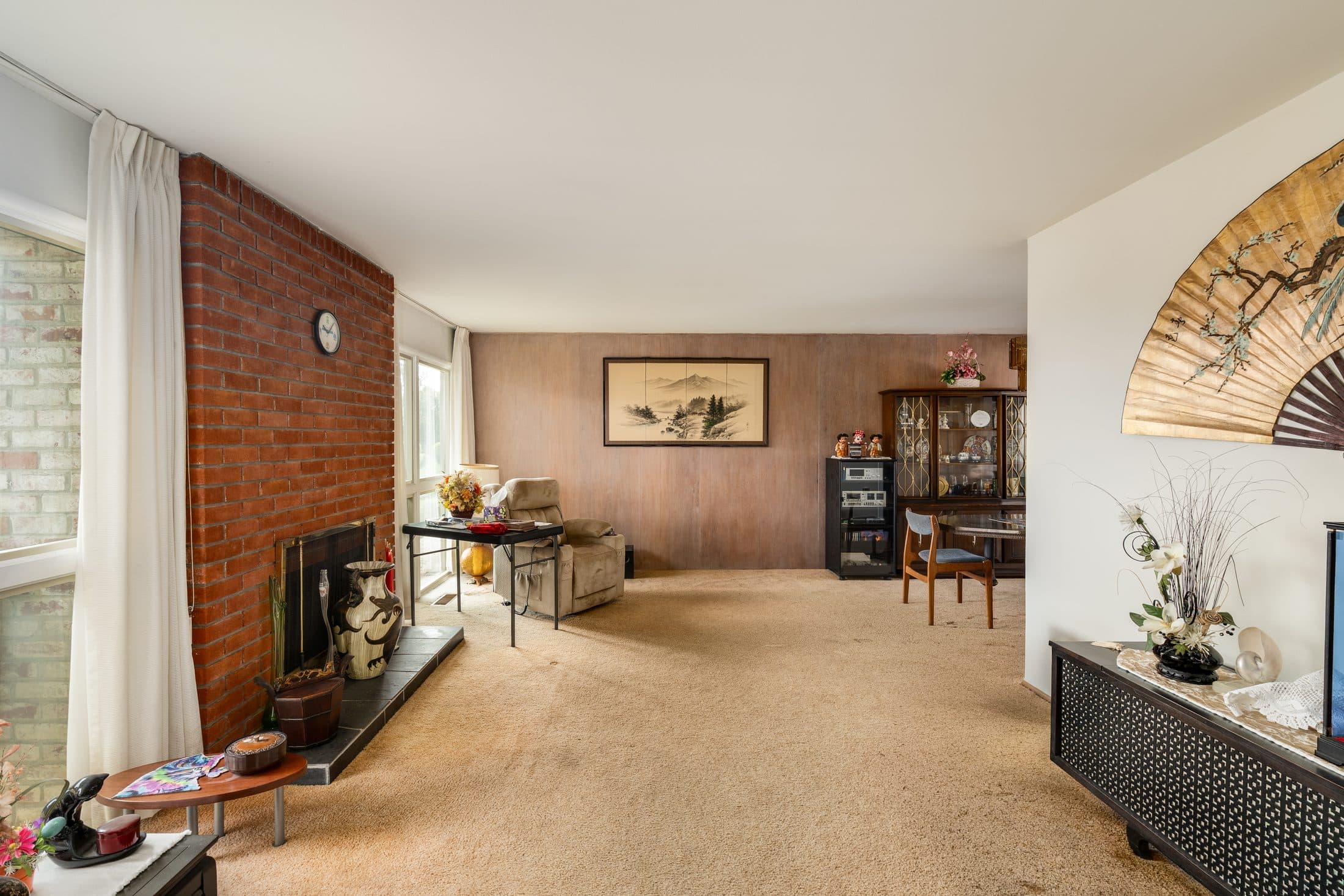 898 Lomita Avenue. The living room and its brick fireplace.